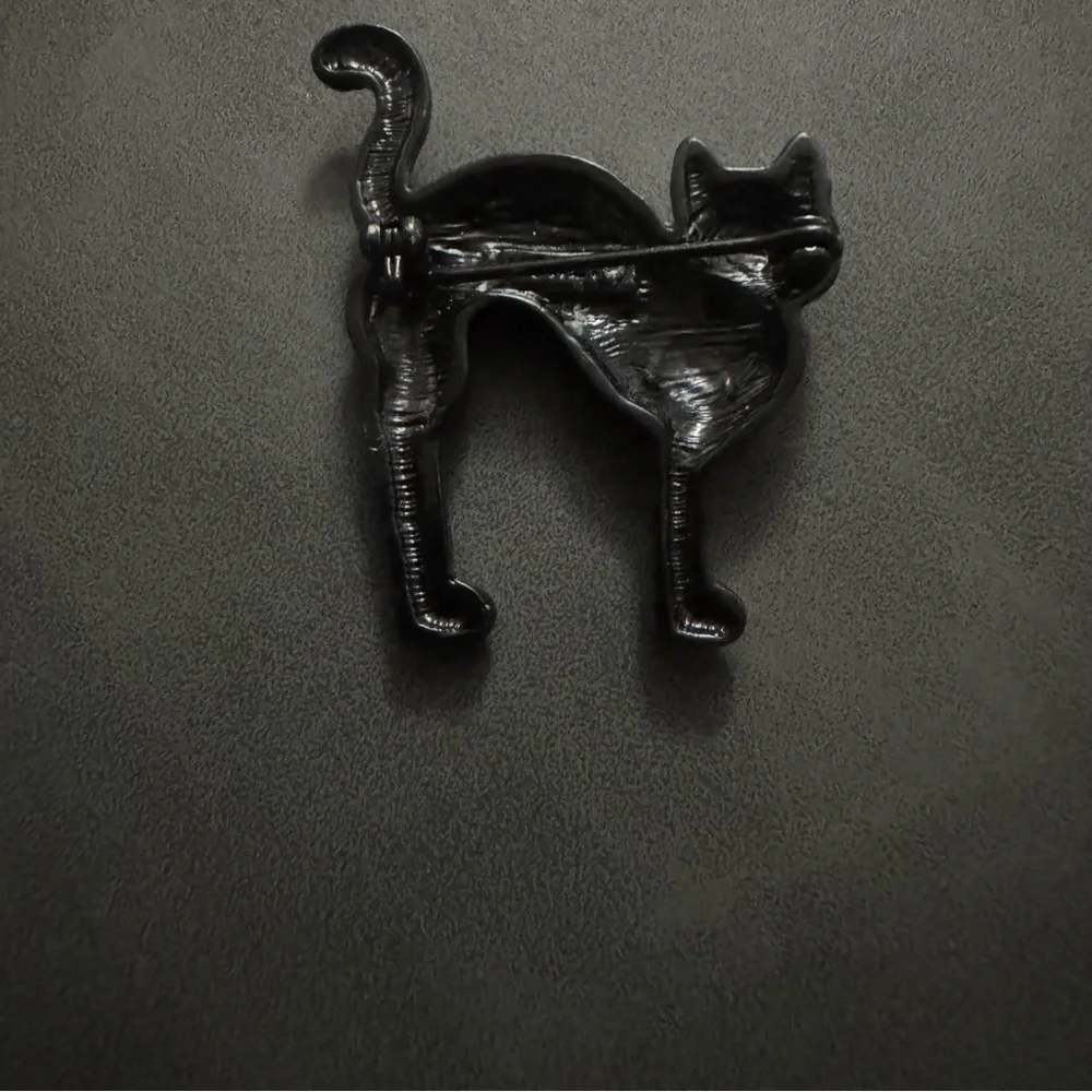 Monet Black Crystal Cat Pin with Emerald Green Eyes